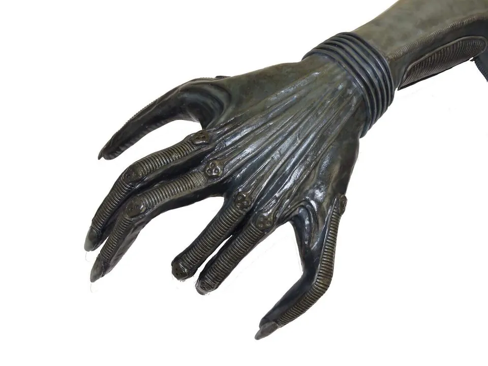 Xenomorph hand prop with elongated fingers and ribbed detail