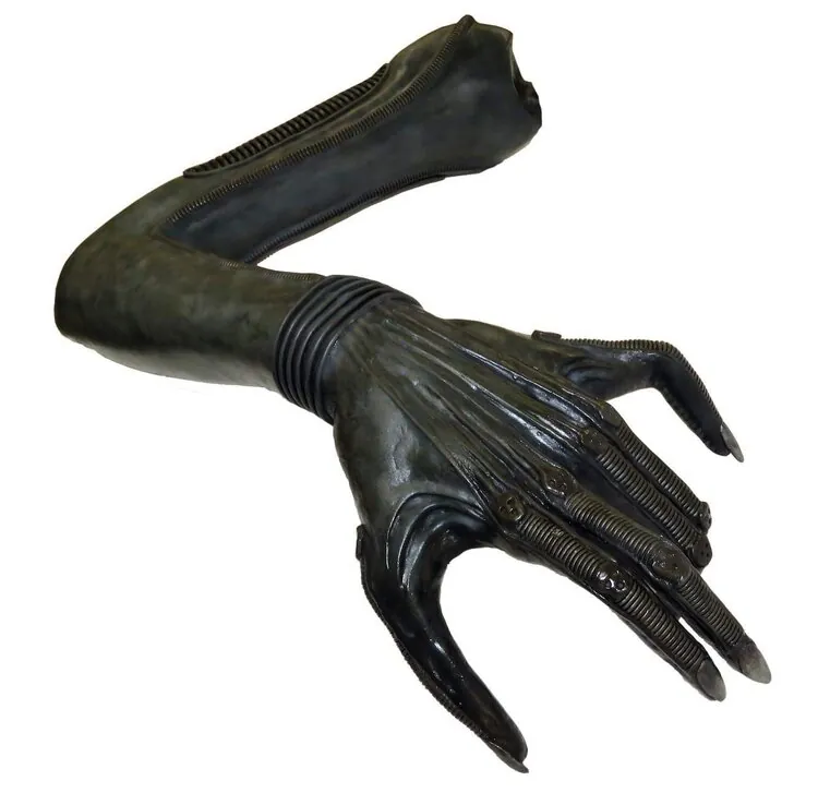Complete Xenomorph arm and hand against a plain background