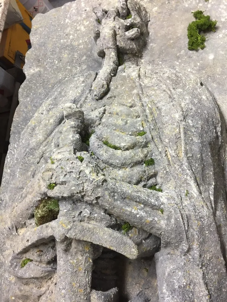 Detail of the skeletal figure clasping a sword