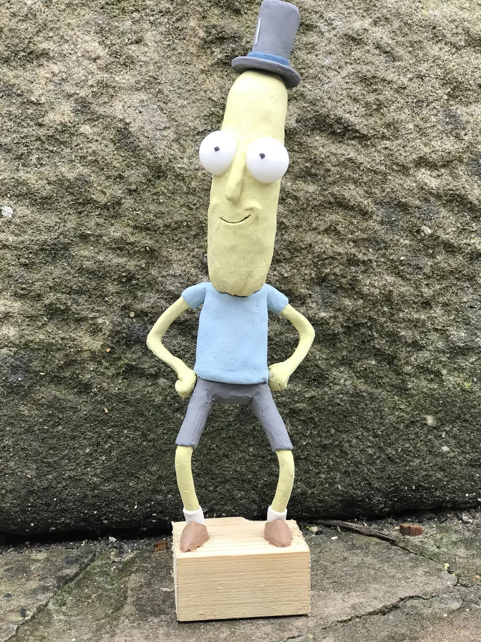 Tall plasticine character wearing a top hat