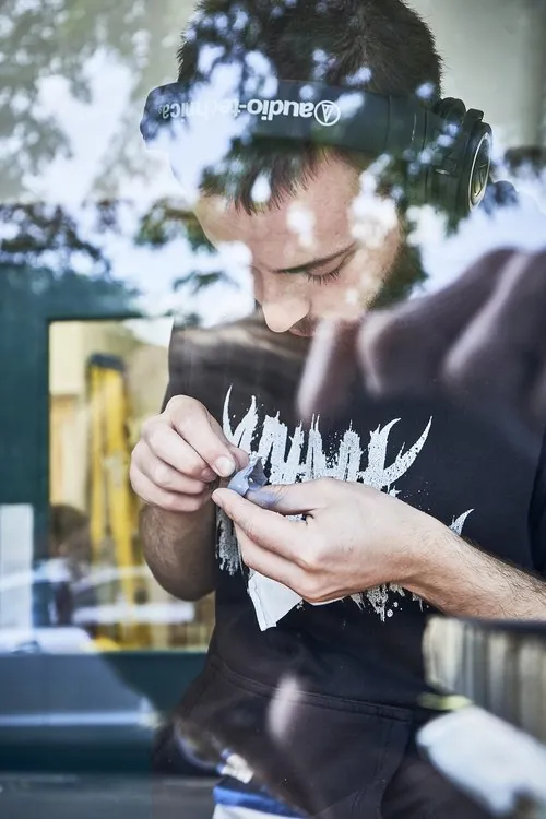 Matthew working on a puppet component at the workbench