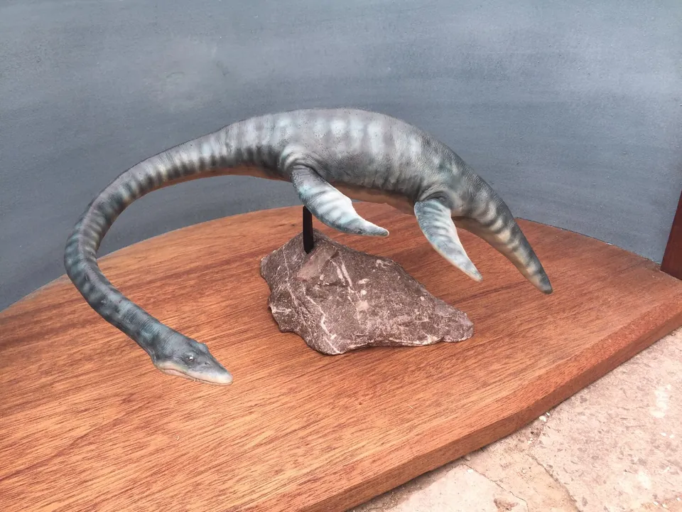 Puppet posed with its neck curving down towards the base
