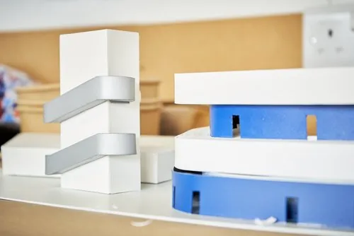 White and blue stadium model during construction
