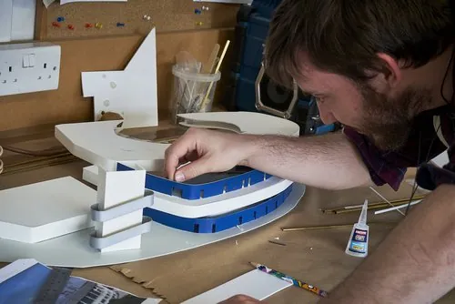 Fitting details to the curved stadium model