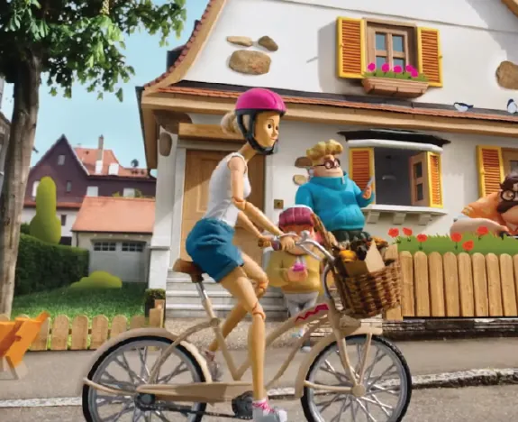 Puppet cyclist on a miniature street set