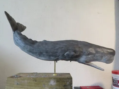 Side view of the sperm whale puppet with raised tail