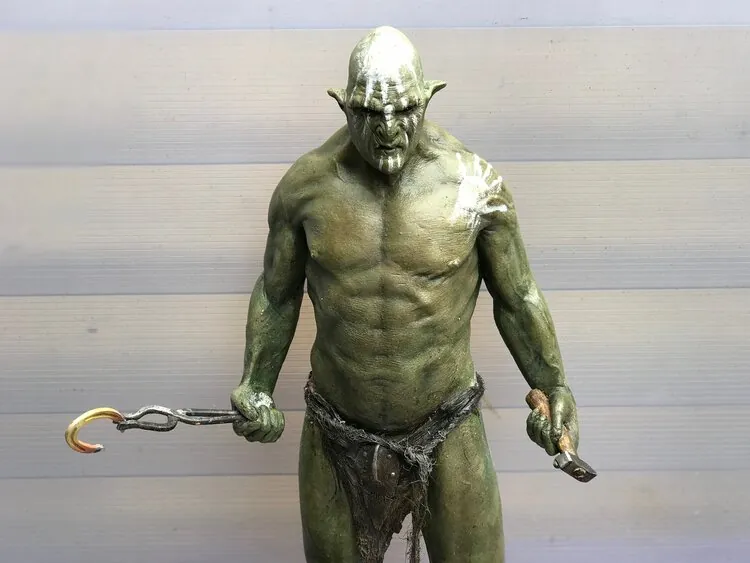 Finished Uruk-Hai figure holding tools